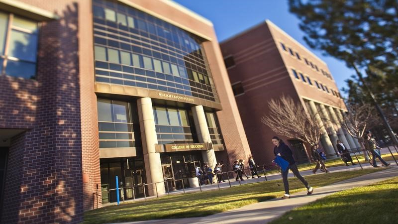 Students in front of entry to William J. Raggio College of Education Building 