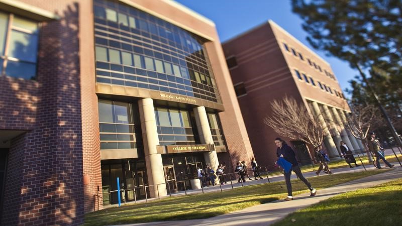 Students in front of entry to William J. Raggio College of Education Building